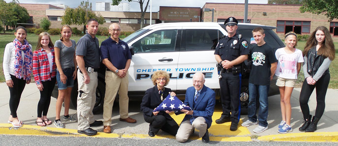 Integrated Language Arts teachers Joseph S. Pizzo and Doreen Aiello (center), pictured with seventh graders and Chester and NYNJPA police officers outside Black River Middle School.  The students work with the police during their study of the novel, "The Outsiders."
