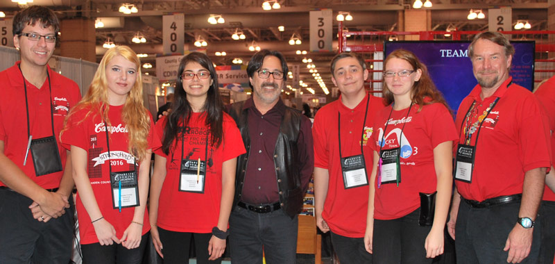 Keynote speaker Fredi Lajvardi, a noted STEM educator, with the members of the Camden County Technical Schools Robotics team.
