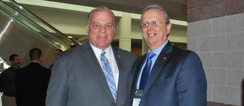 At the Legislative Update panel, Dr. Lawrence S. Feinsod, NJSBA executive director, pictured at right, with state Senate President Steve Sweeney.