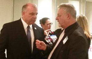 New Jersey Senate President Steve Sweeney, at left, talks with Michael Vrancik, NJSBA director of governmental relations.