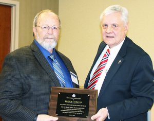Bruce Young, who was an alternate member representing Bergen County, was honored upon his retirement from the NJSBA Board of Directors. He is shown here (at left) with NJSBA President Don Webster. 